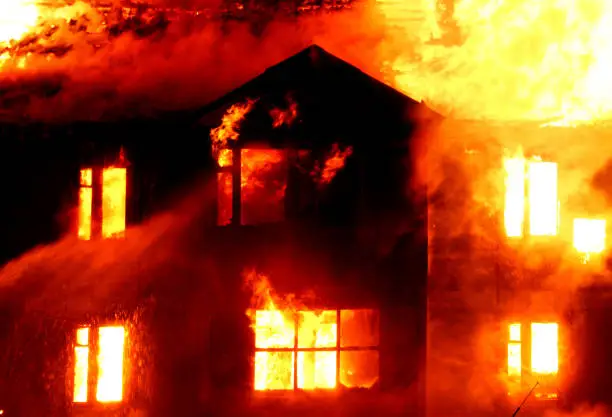 Wall of the burning old wooden house