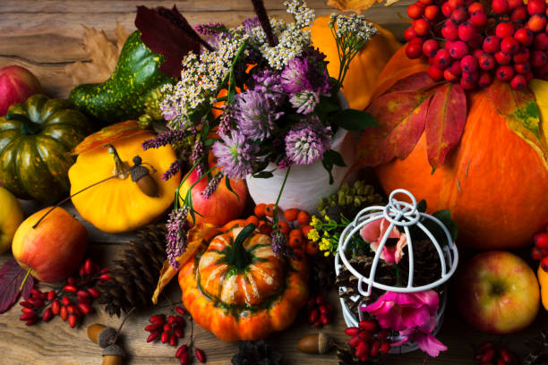 istock Fall decor with birdcage, apples and flowers 1023284110