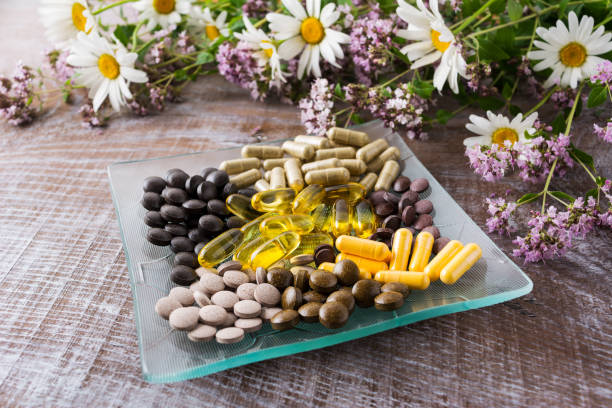 Ayurvedic pills with chamomile and tansy flowers