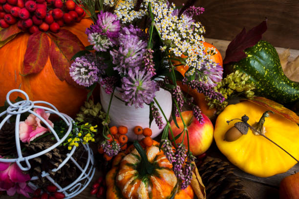 istock Thanksgiving decor with yellow, green, orange squash and clower 1023284150