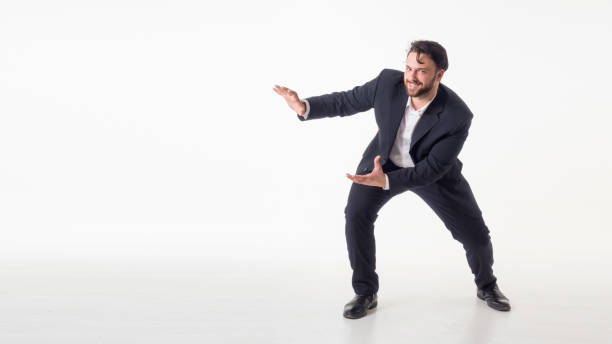 istock Businessman isolated over white background presenting copyspace 1023300414
