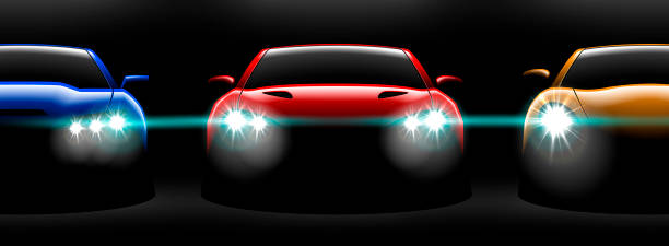 istock realistic red yellow blue three sport car view with unlocked headlights in the dark 1023304708