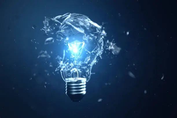 Photo of 3D illustration Exploding light bulb on a blue background, with concept creative thinking and innovative solutions.