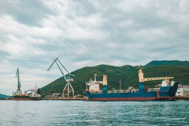 istock port in montenegro. ships loading with goods 1023311566