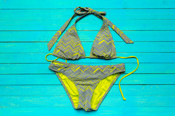 istock swimsuit on wooden table 1023311738