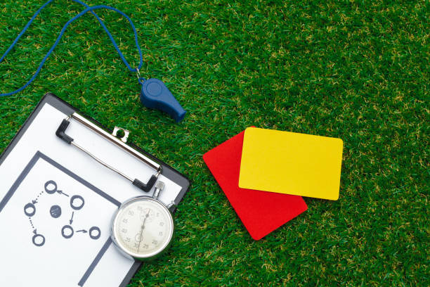 two penalty cards and a whistle for the referee