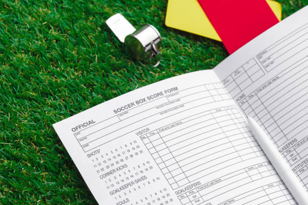 istock two penalty cards and a whistle for the referee 1023311834