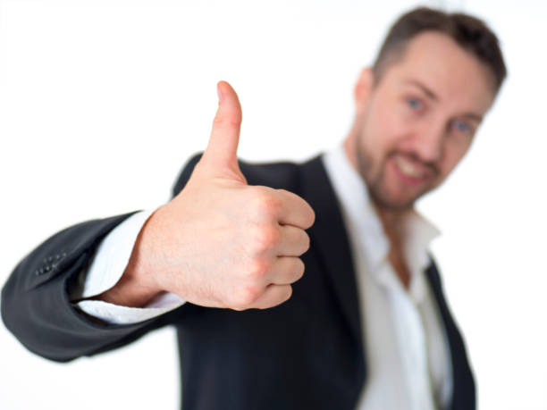 istock Smiling businessman with thumb up, isolated on white background 1023330816