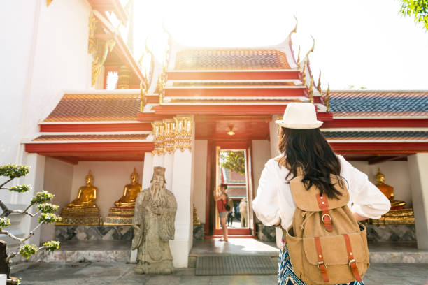 istock Asian woman standing in front the gate 1023338750