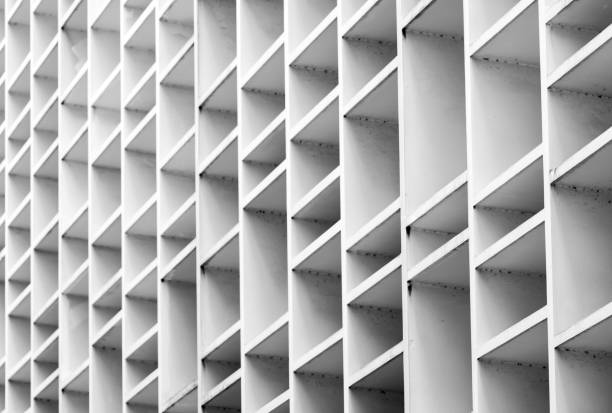 istock Closeup ventilated facade of concrete building. White ventilation with creative and beautiful pattern architecture. 1023341724