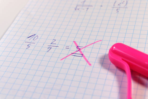A math example and teacher found some mistake. He used pink pen for check it out this result. Exam time
