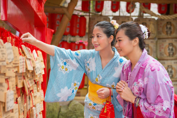 istock woman hanging their wishes 1023347122