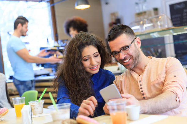 istock Couple enjoying time together in cafe 1023353002