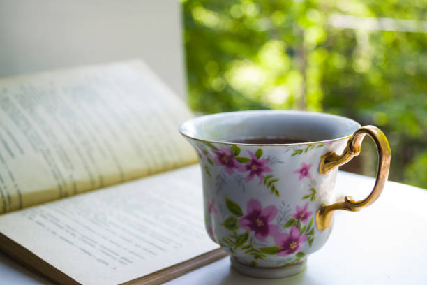 istock A cup of tea and a book. 1023355804