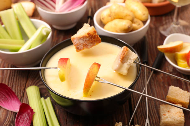 istock cheese fondue with fruit and vegetable 1023356032