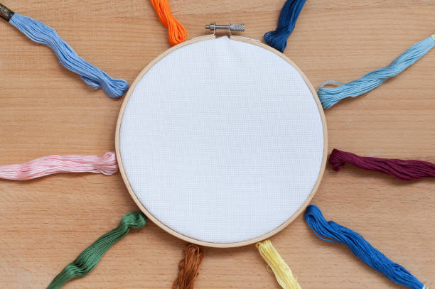 istock Round wooden hoop with a white cloth. 1023356256