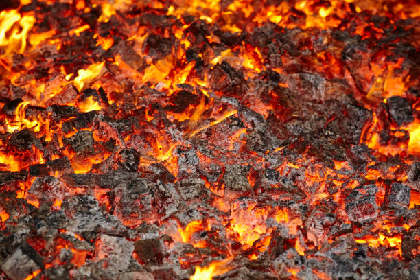 istock Fire. Volcano incandescent material. Hot charcoal bonfire. Carbon emissions 1023356610