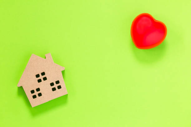 istock home shape wood and heart 1023365008