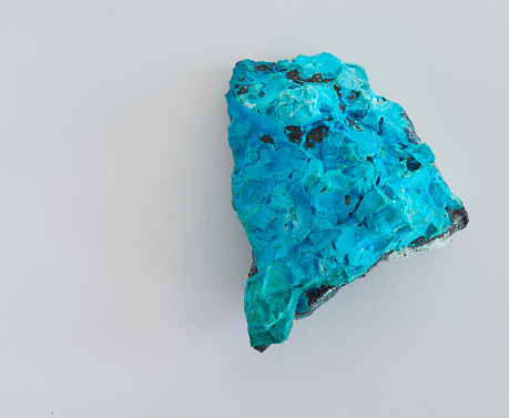 a turquoise mineral rock on a white back ground