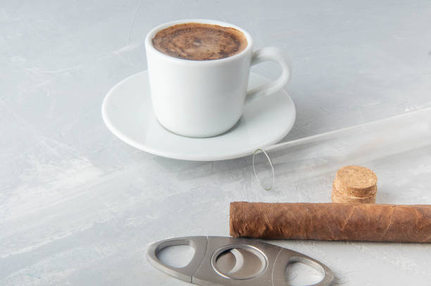 Cup and Turk coffee, cigar and guillotine isolated on white background.