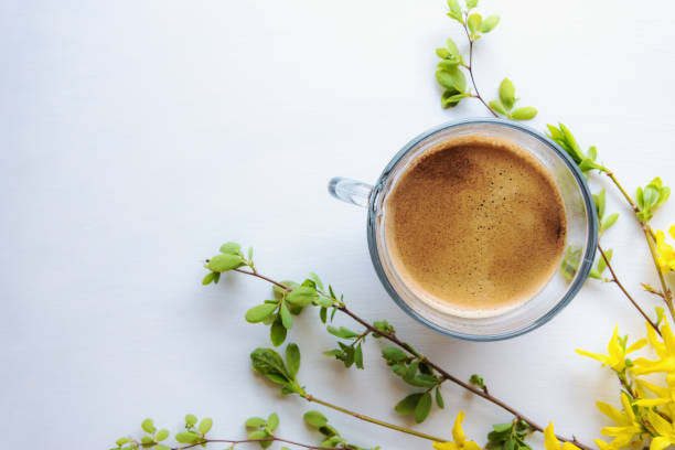 istock A cup of aromatic coffee and spring flowers. Free space 1023372854