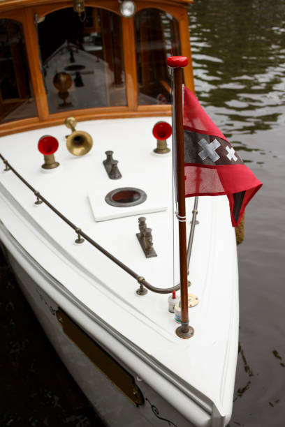 istock Old fashioned boat in Amsterdam canal. 1023375178