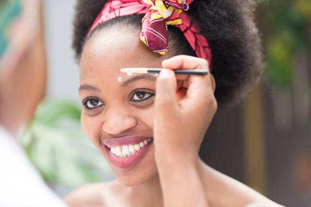 istock Beautiful young woman getting traditional make up done 1023377440