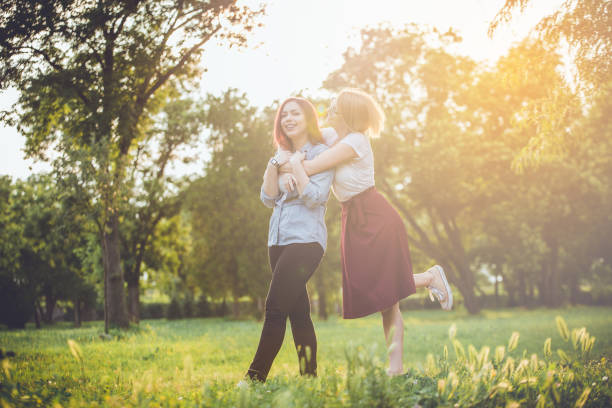 istock Girls embraced at park 1023379330