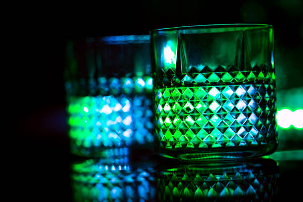 istock bar colored lights with glasses of alcohol 1023383404