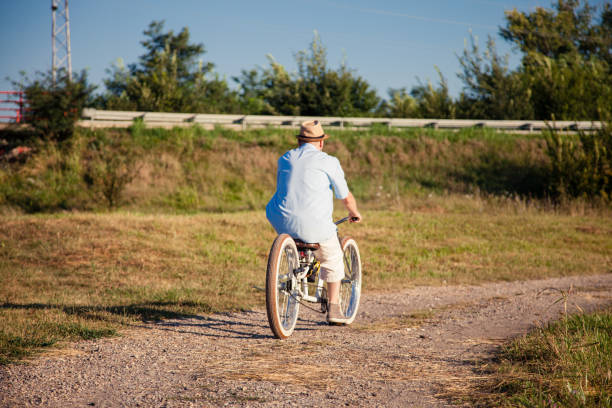 istock Man cycling along gravel path 1023384066