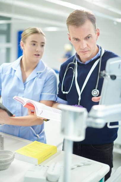 istock hospital team checking meds records on the ward 1023387318