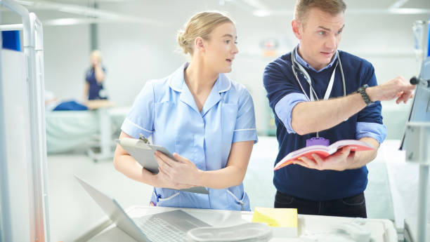 istock doctor checking meds with young nurse 1023388980