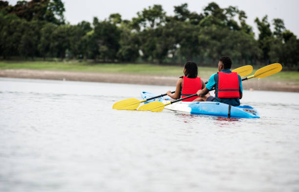 istock Couple canoeing in a lake 1023400926