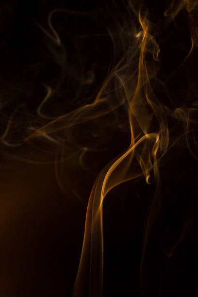 istock Gold smoke on black background. 1023401488