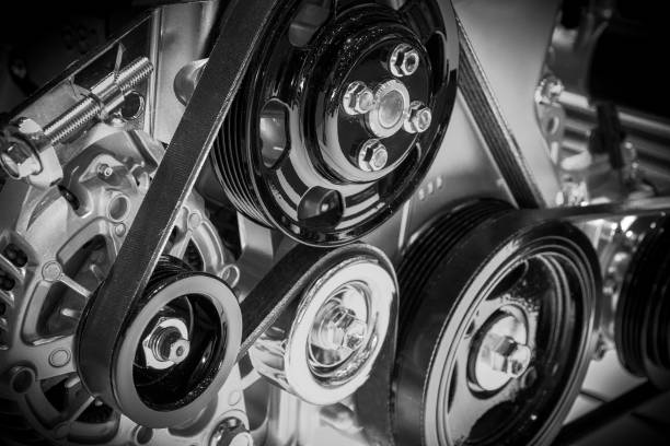 car engine View on pulley and belts on a car engine. crank mechanism photos stock pictures, royalty-free photos & images