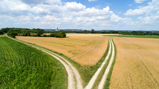 Aerial view of country road between fields near Neu-Ulm and Ulm in Bavaria, Germany