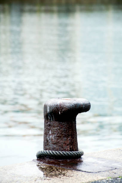 istock Harbor mooring post, thick rope, sea background. 1023402854