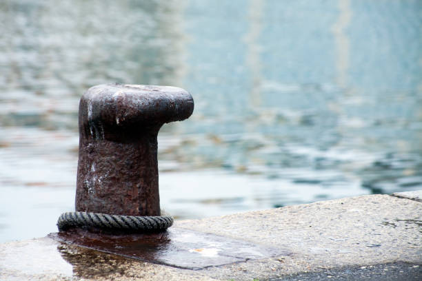 istock Harbor mooring post, thick rope, sea background. 1023403996
