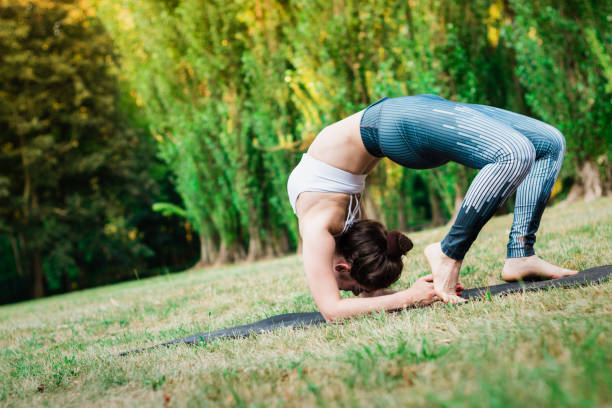 istock Slim young woman staying on green grass in Elbow Bridge 1023407714