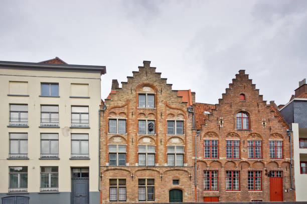 Building exteriors in Bruges with elaborate decoration on the exterior. These are buildings on the edge of the main canal.