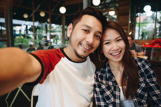 istock Happy couple taking selfie together 1023421286
