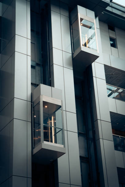 istock modern metal and glass elevator outside 1023421590
