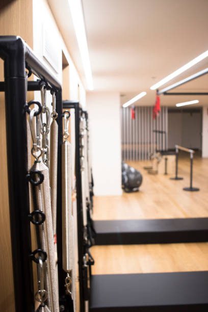 istock Pilates machine fitness studio gym room with training machines 1023421668