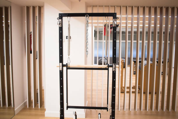 istock Pilates machine fitness studio gym room with training machines 1023422936