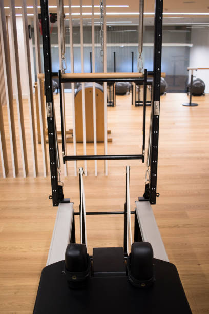 istock Pilates machine fitness studio gym room with training machines 1023422948
