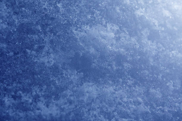istock Background of grainy abstract blue snow 1023427402