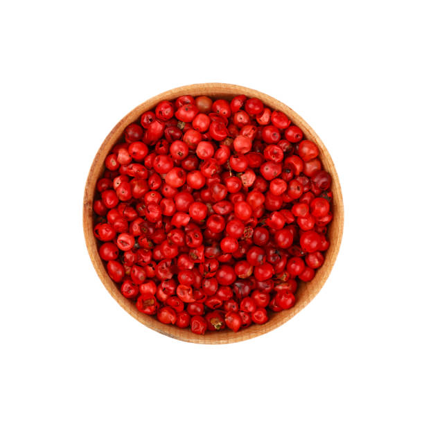 wooden bowl full of pink peppercorns - pink peppercorn imagens e fotografias de stock