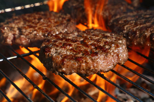 istock Beef burger for hamburger on barbecue flame grill 1023428332