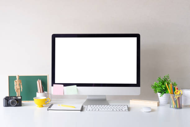 istock Mockup Computer on white table and designer office supplies on desk with workspace. 1023437936
