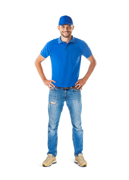 Full length portrait of confident handsome man in blue uniform stock photo